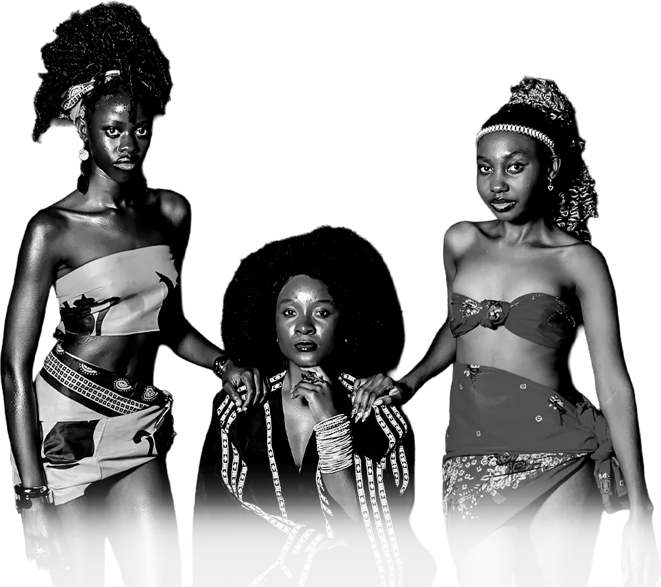 Three women in bold wraps and beadwork pose together at night.